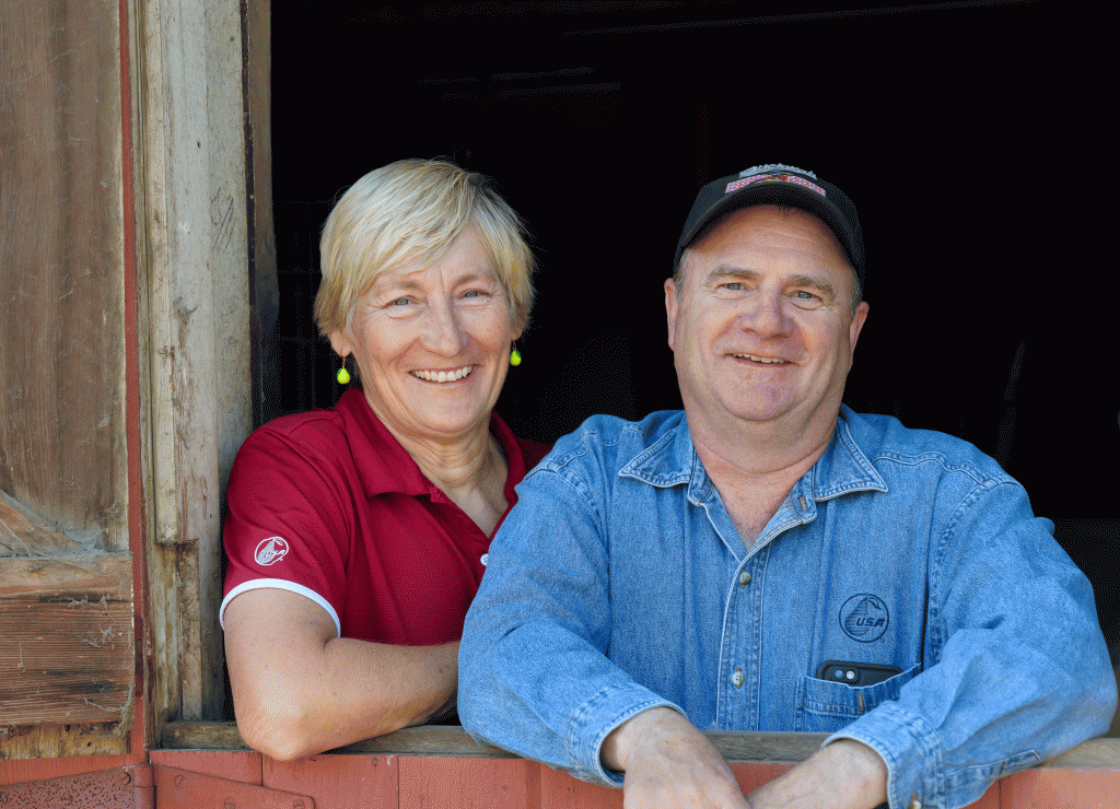 Jon and Debra Laraway in the doorway to their iconic red barn